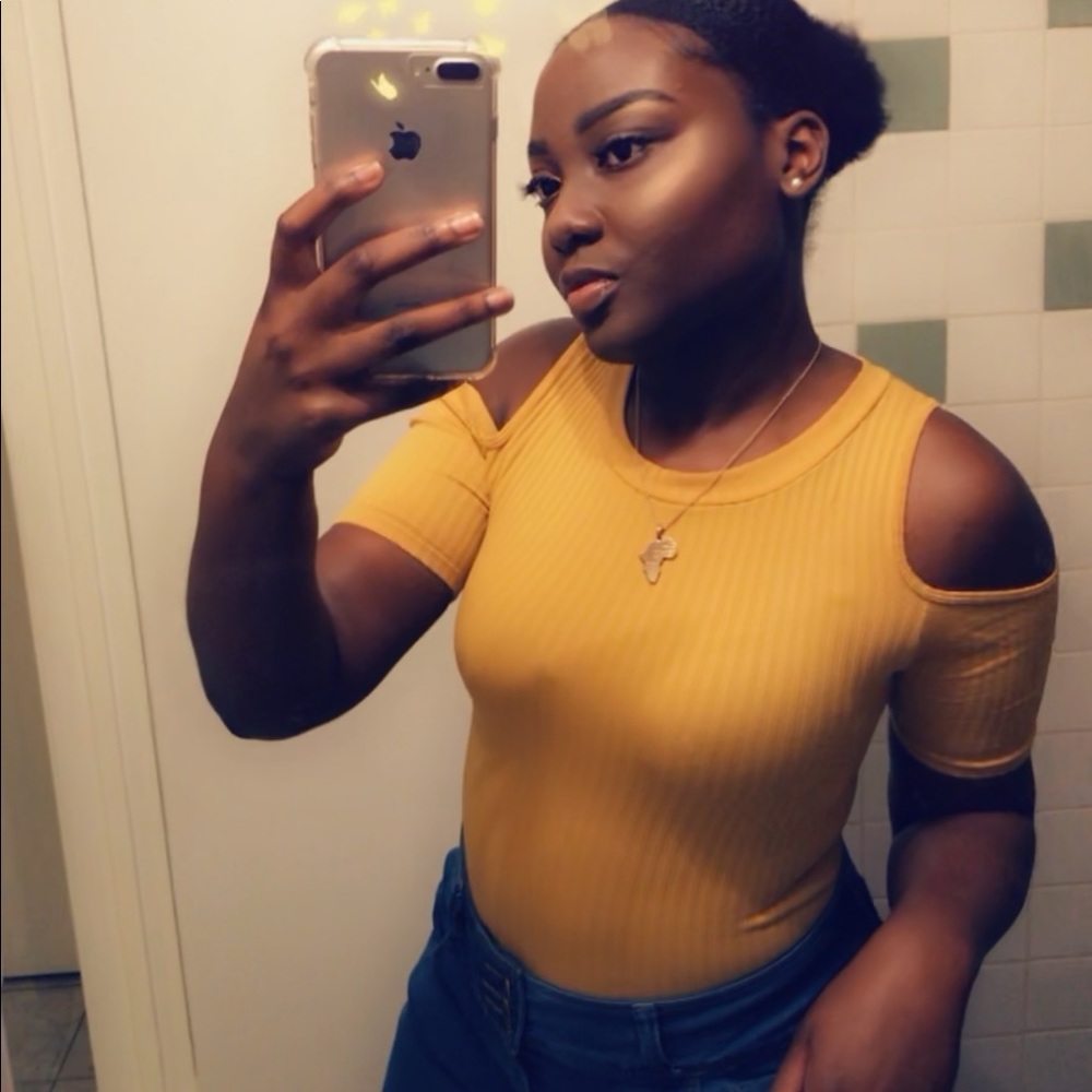 One piece yellow tight fitted shirt